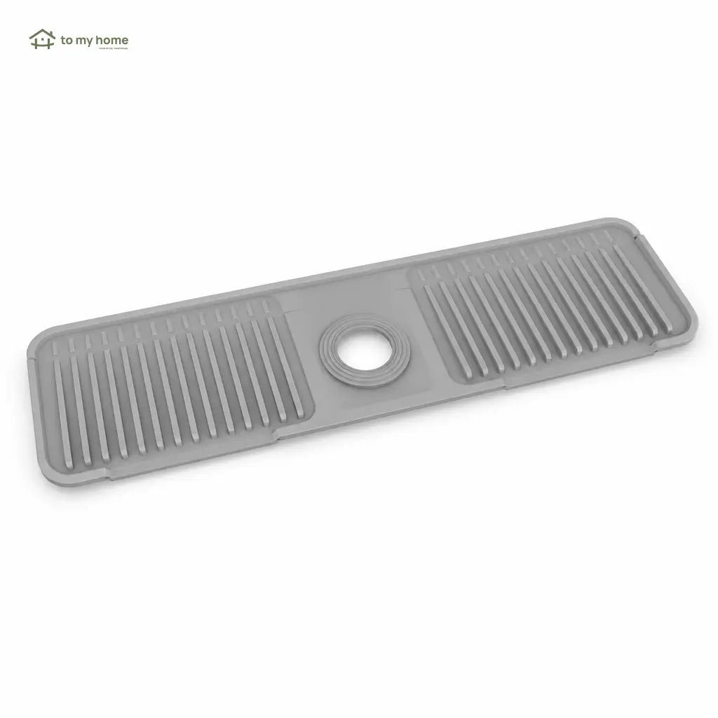 Tapete de silicón para grifo con drenado automático y seguro de botón para mantener seca tu tarja de cocina sin salpicaduras